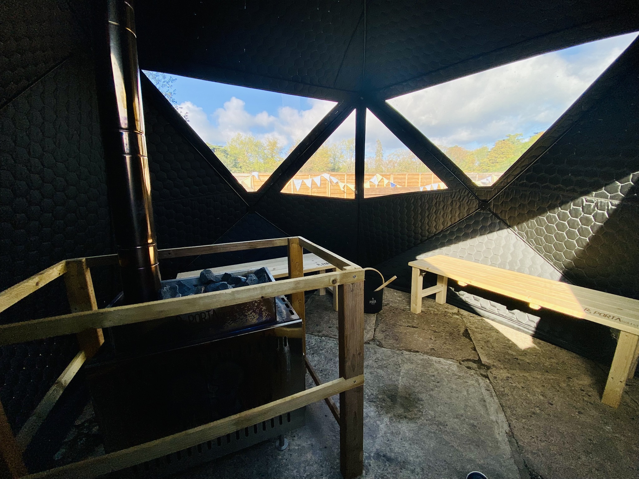 Sauna and cold plunge session beside the heated open air pool in Cirencester